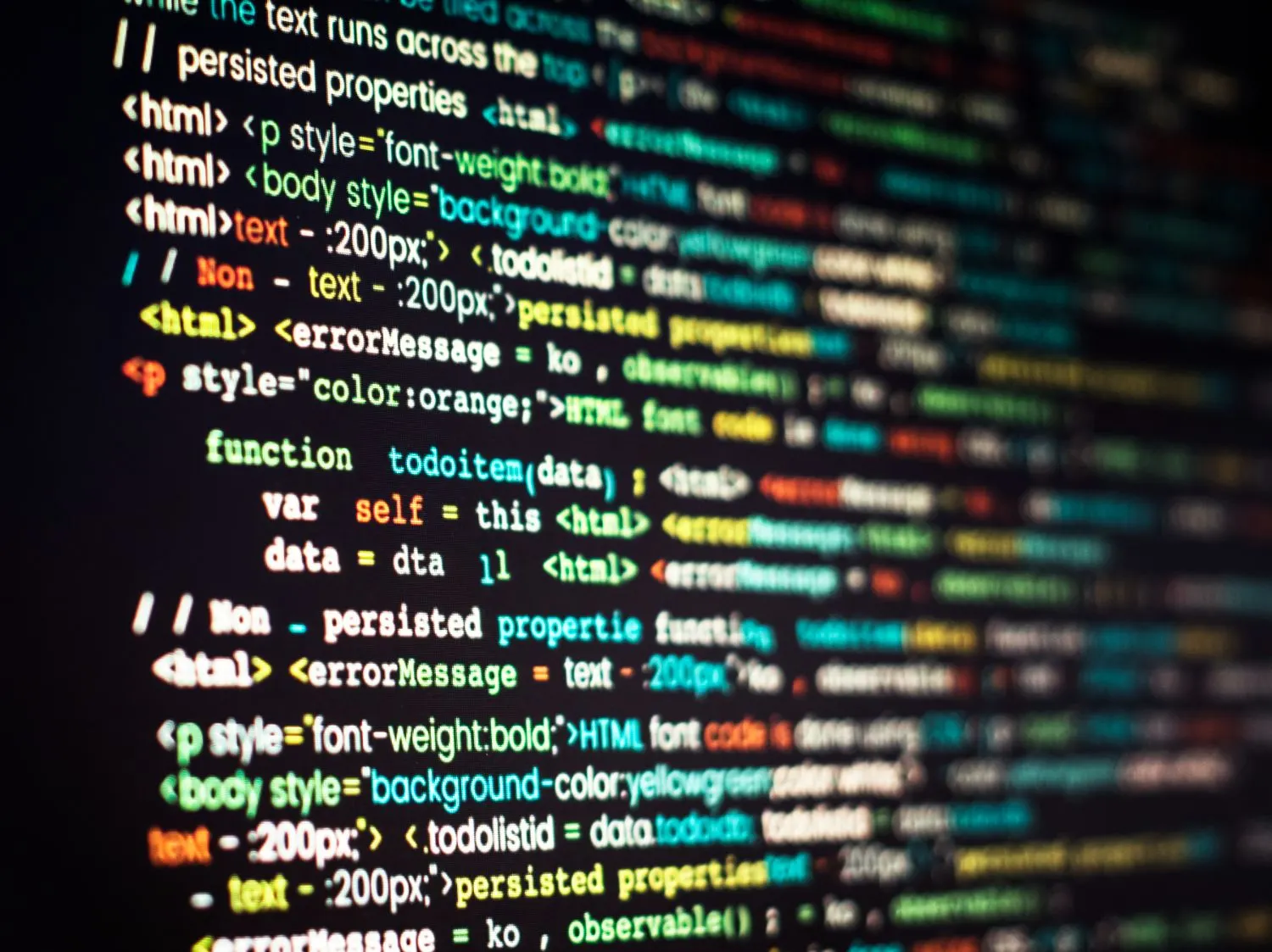 Primer plano de una pantalla con código HTML y JavaScript